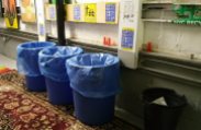 Recycling bins in the trash room
